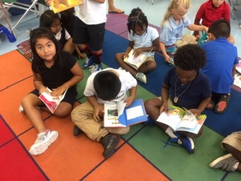 Reading together on the classroom rug