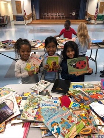 Picking out new books at the donation table