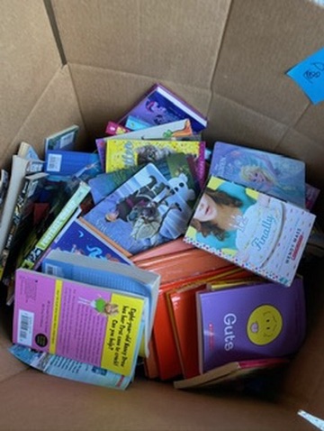 A box overflowing with donated books